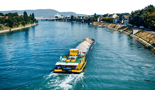 Photograph of a barge transporting mierals along the Rhine river