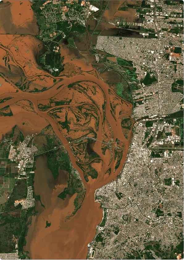 Satellite imagery of a city and river running through it
